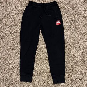 The North Face Kids Black Sweatpants with Red Logo
